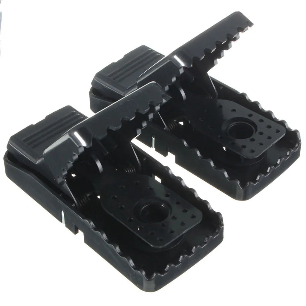 Six black snapping mousetraps with smooth plastic surface showing precise dimensions