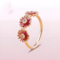 Three pink daisy rings with pink gemstone inlay in 925 sterling silver