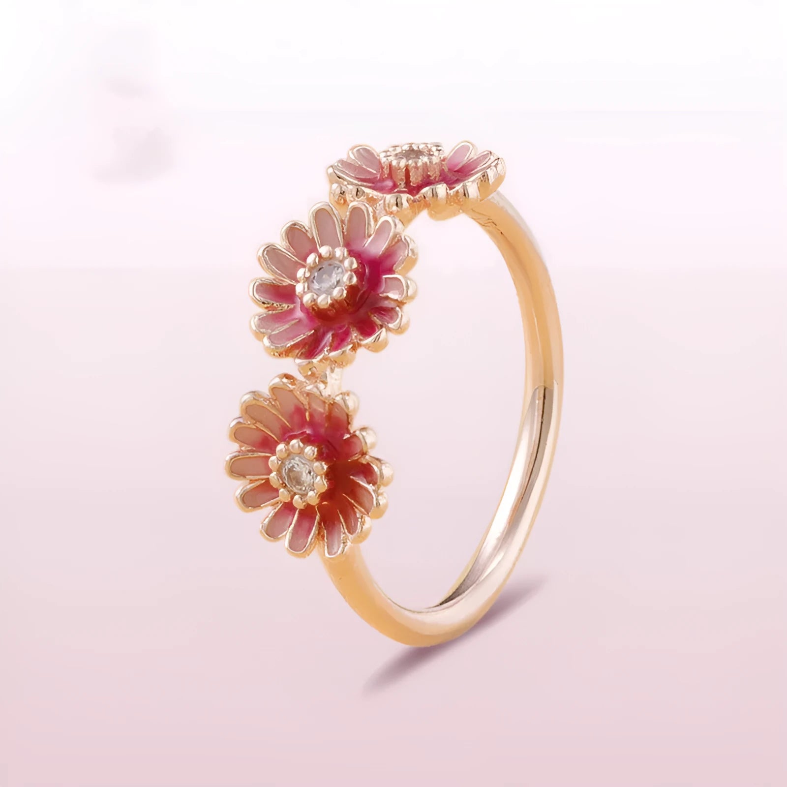 Three pink daisy rings with pink gemstone inlay in 925 sterling silver