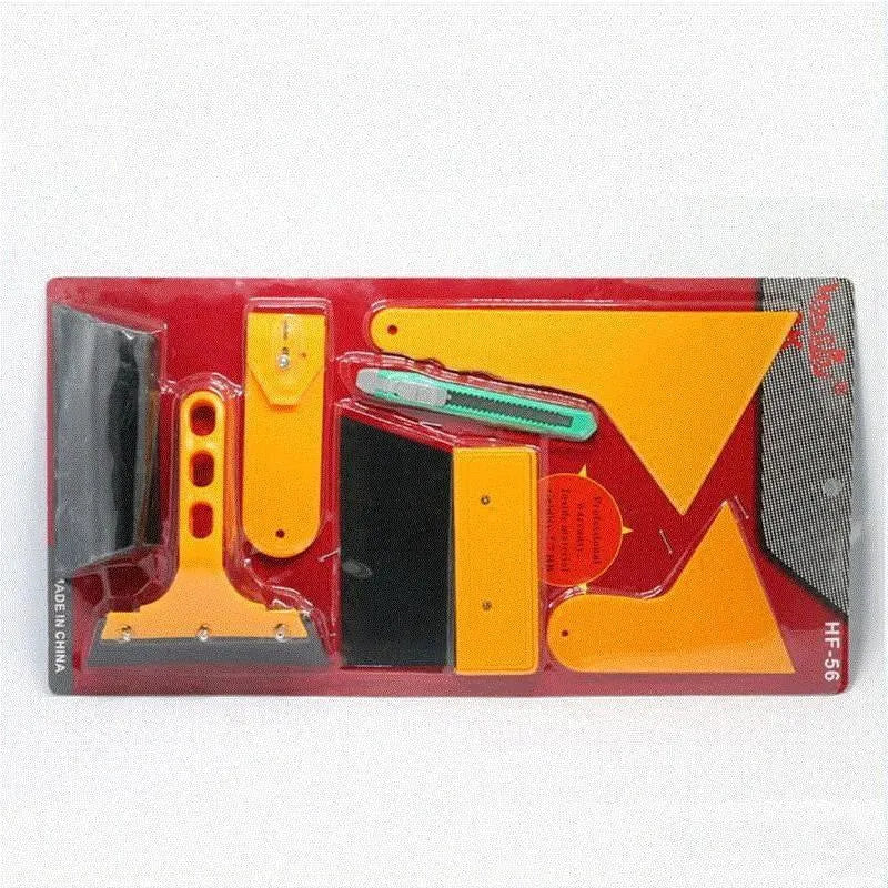 Seven-piece automotive and architectural film tool set with scrapers, knives, and a pressing block.