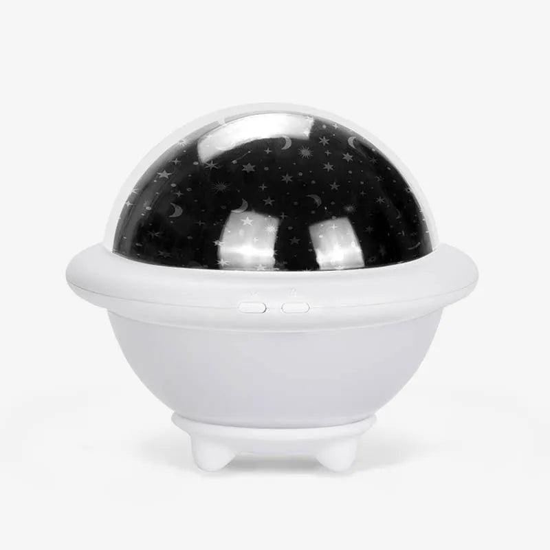 Green UFO-shaped starry sky projection light with button switch on a plastic base.