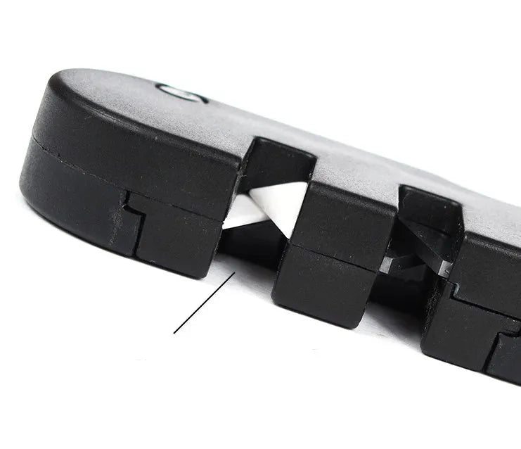 Pocket Pal knife sharpener in black with diamond rod, carbide blades, and ceramic stones open for use