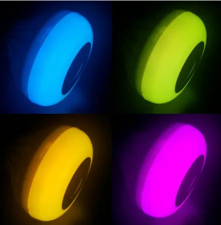 White Bluetooth speaker LED light bulb with E27 base showing multi-colour lighting options