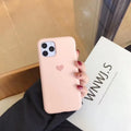 Silicone phone case for iPhone in solid colours including dark green, light pink, and purple.