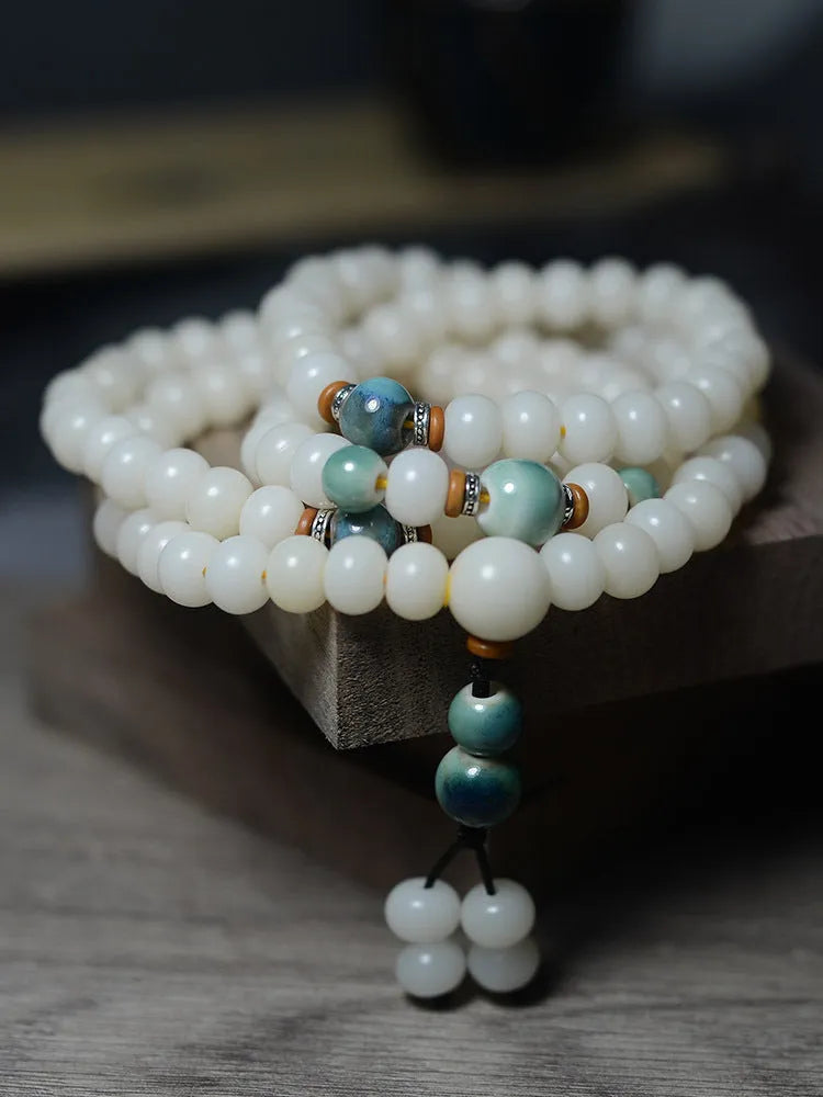 White jade bodhi root bracelet with 108 flat round beads in two sizes