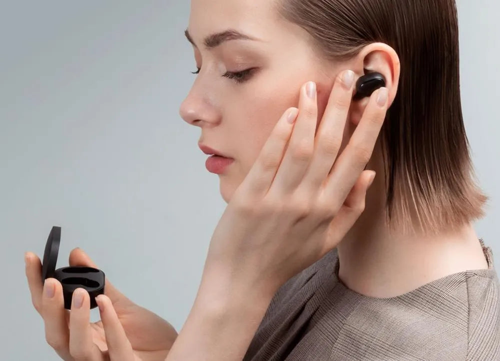 Redmi AirDots Black true wireless Bluetooth earbuds and charging case.
