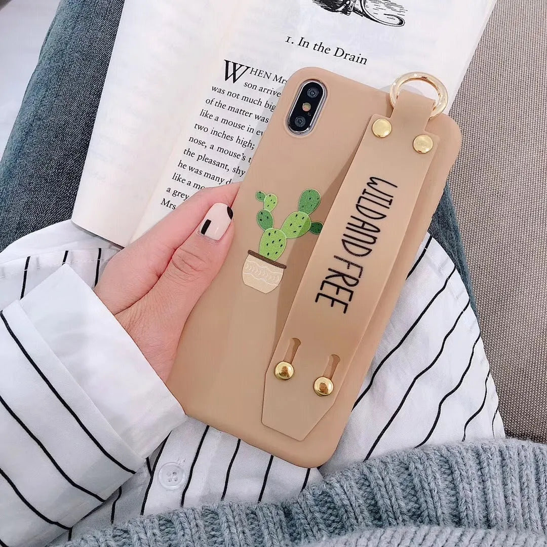 Green graffiti-style phone case with a wristband holder for an iPhone.