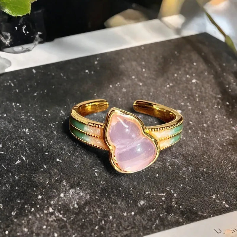 Adjustable copper ring with vintage gourd, flower and bow designs featuring inlaid zircon accents