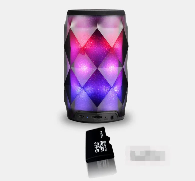 Black crystal diamond cut Coca-Cola can Bluetooth speaker lantern with colourful LED lights illuminated.