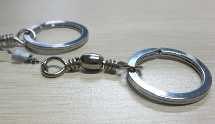 Survival wire saw with stainless steel blade and thumb rings for outdoor cutting tasks