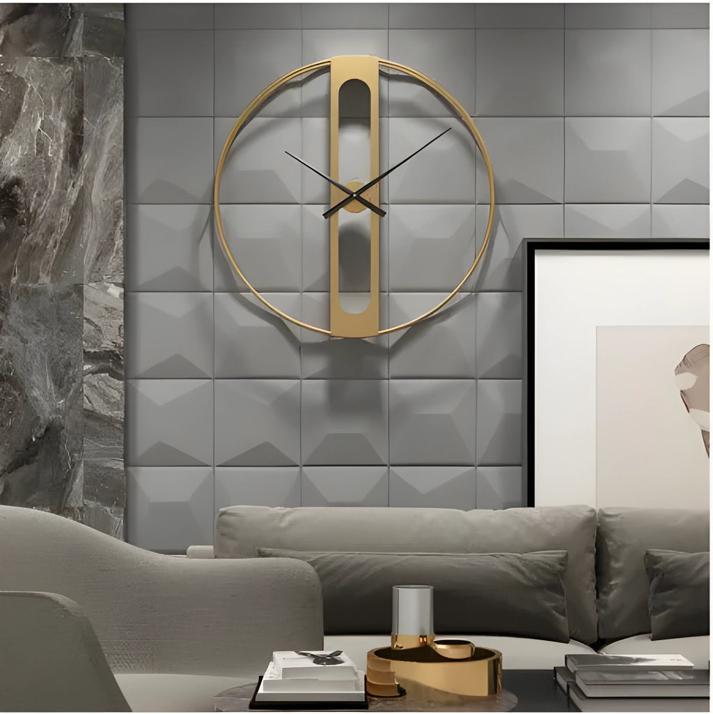 Large round metal wall clock with black dial and gold Arabic numerals on a white wall