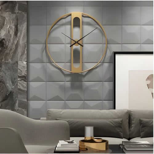 Large round metal wall clock with black dial and gold Arabic numerals on a white wall