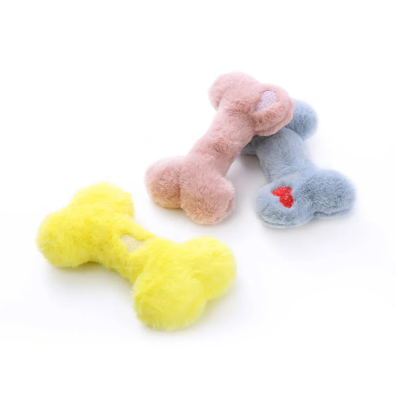 Blue Love Bone shaped plush dog toy with squeaker on a plain background.