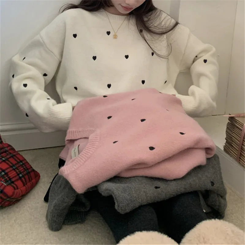 Women's acrylic pullover sweater with embroidery detail in milky white colour showing loose fit design
