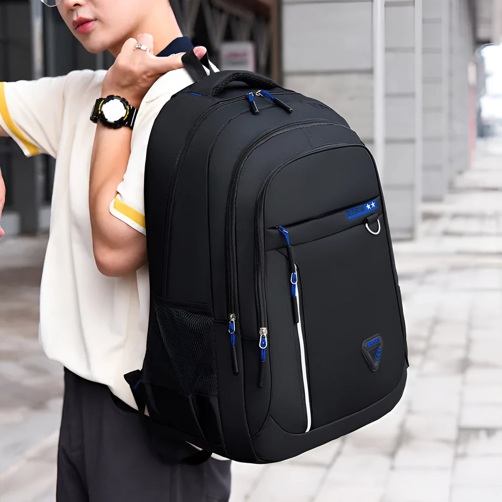 Men's Oxford cloth schoolbag in black with a large main compartment and an air pillow shoulder strap.