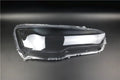 Transparent plastic headlight housing covers for driver and passenger positions