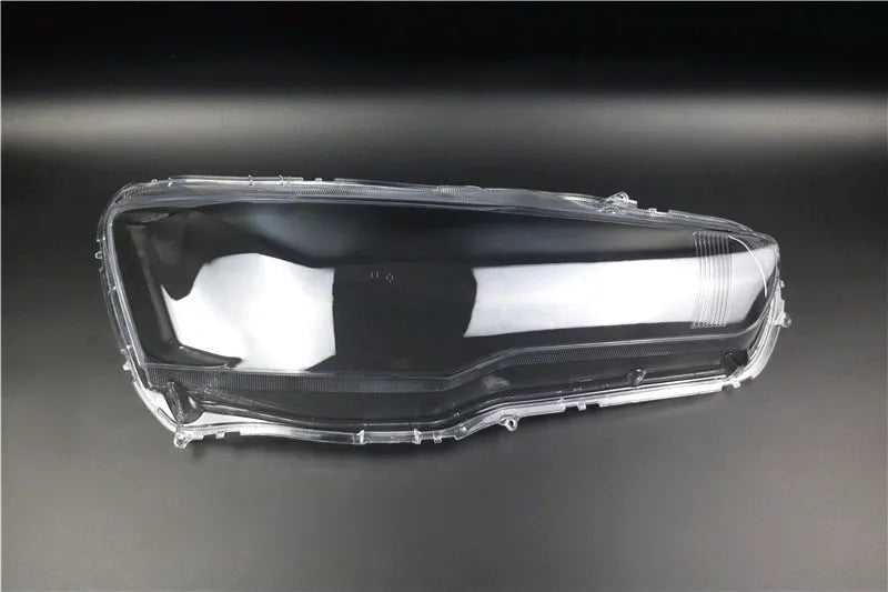 Transparent plastic headlight housing covers for driver and passenger positions