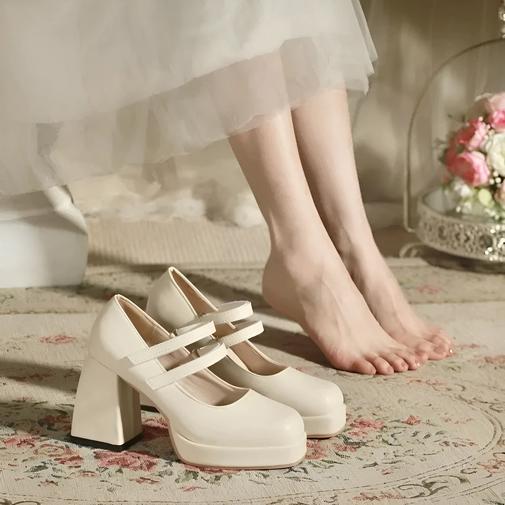 White Mary Jane chunky heel wedding shoes with square toe and buckle closure on a white background