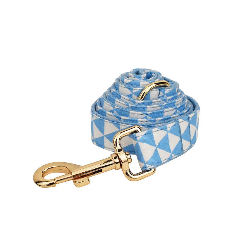 Blue cloth dog collar, leash, bow, and vest four-piece pet accessory set shown with size options