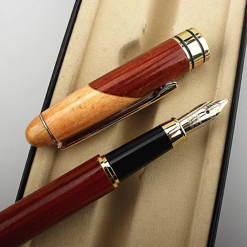 Metal ballpoint pen with wooden colour finish and black bag on white background