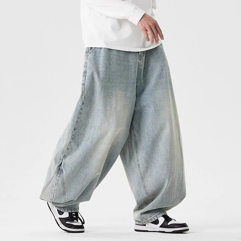Men's plus size baggy jeans in light blue, dark blue, and black with wide leg straight cut design
