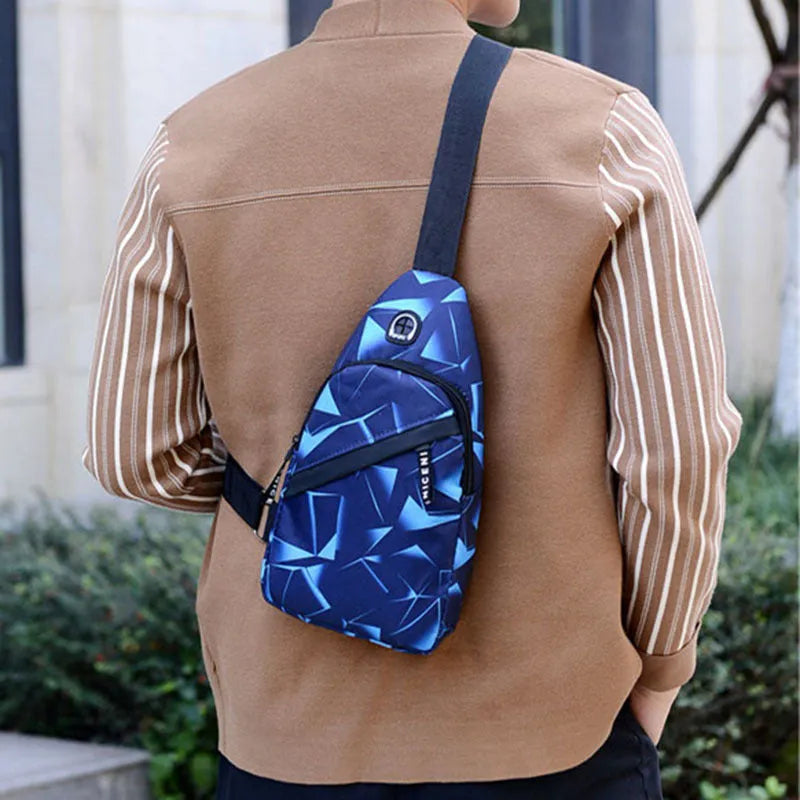 Blue print sling chest crossbody bag for men with an earphone hole and zipper opening.