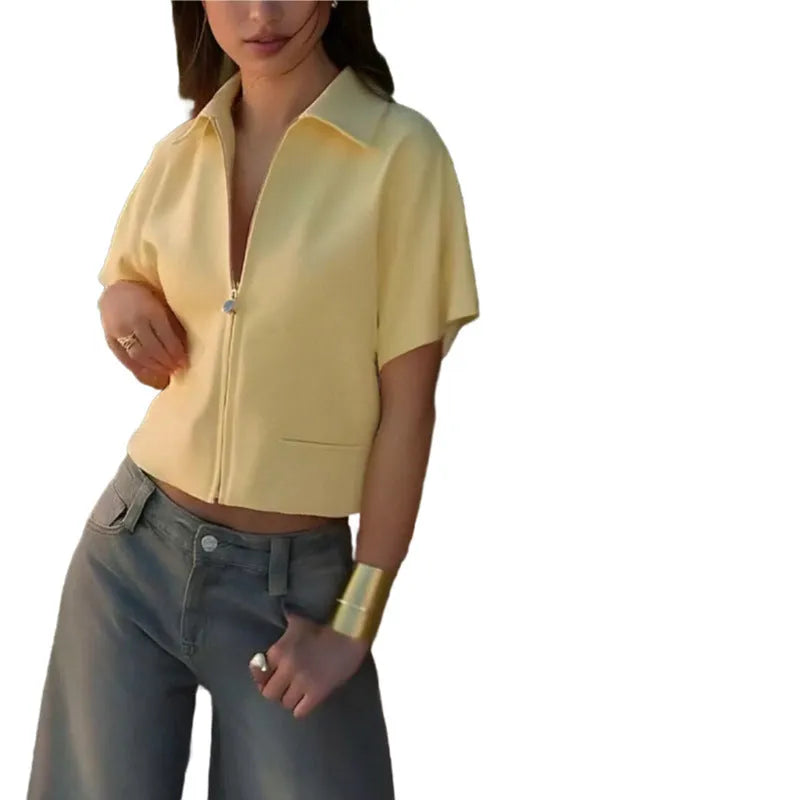 Loose-fit short-sleeve casual top in polyester, shown in white, black, and yellow colour options.