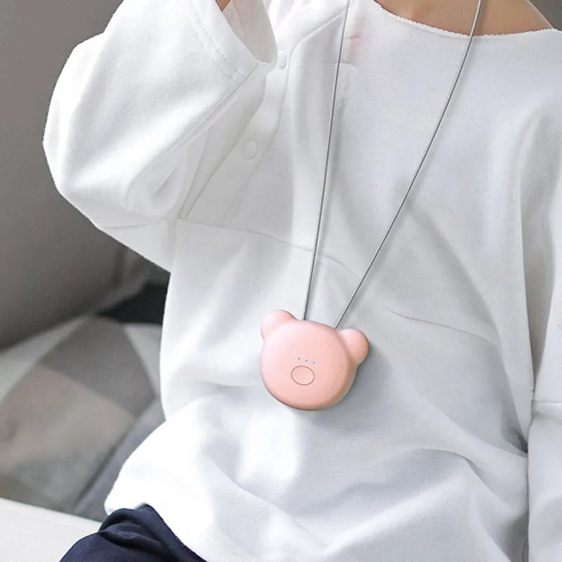 USB rechargeable mini air purifier necklace in blue, showing compact design worn around neck.