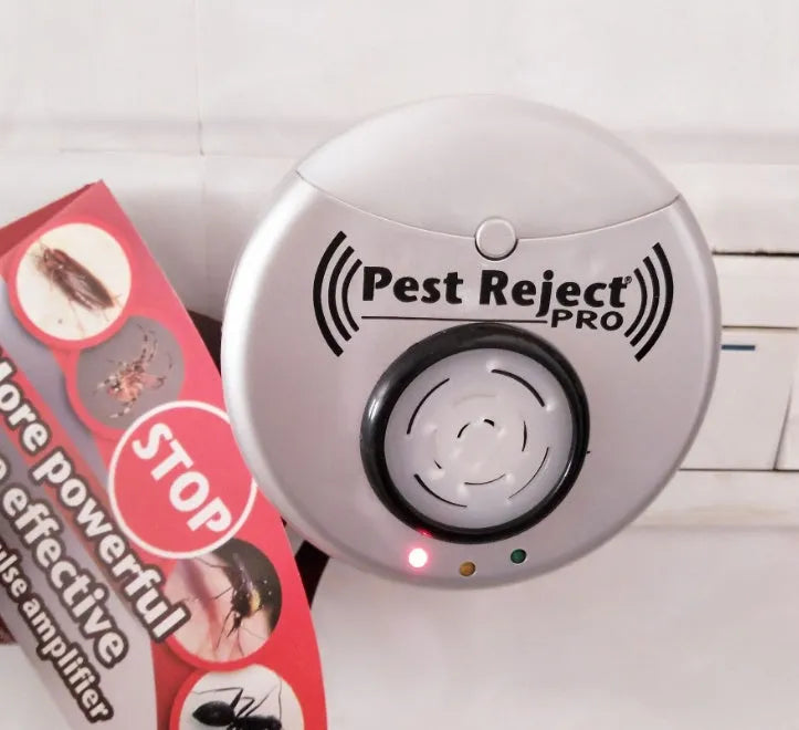 Silver grey intelligent ultrasonic mosquito repellent measuring 10cm, plugged into a white wall socket for indoor pest control