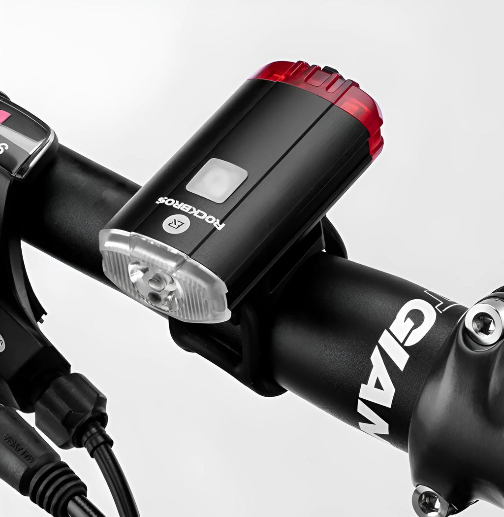 Black bicycle helmet light with aluminium alloy shell showing USB charging port and compact 6.3cm size