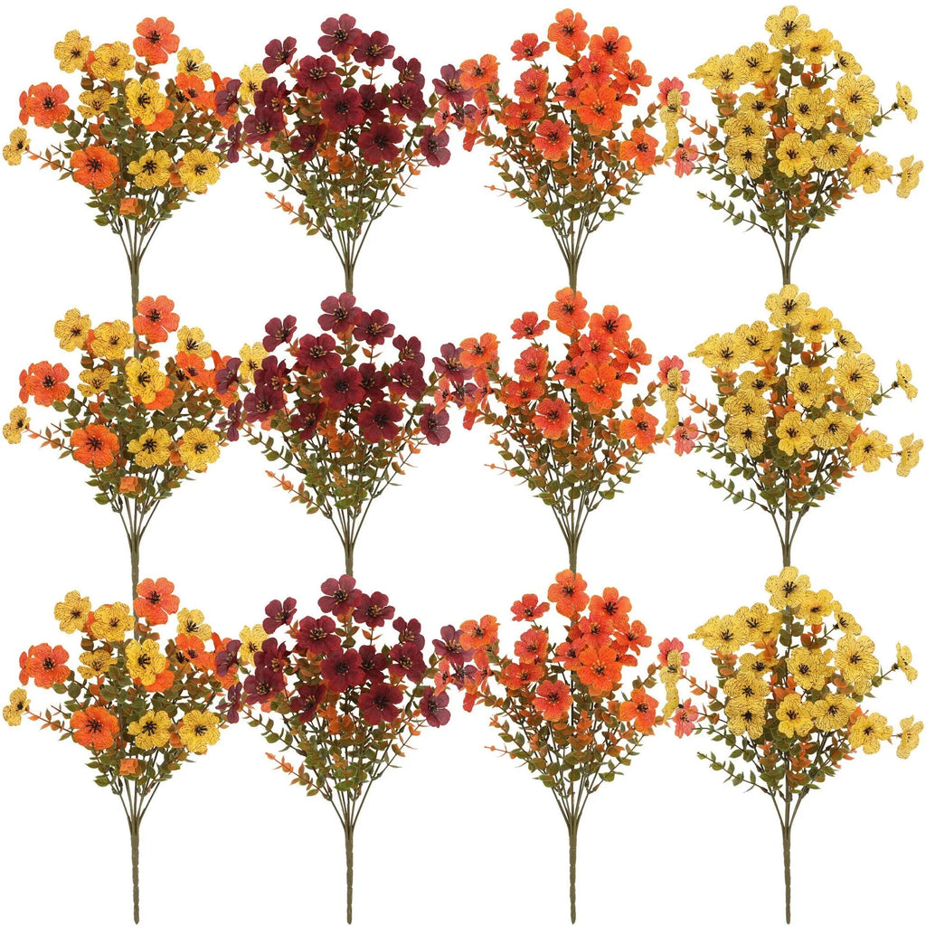 Plastic and silk artificial flower bouquet in autumn colours of red, yellow, orange and orange-yellow.