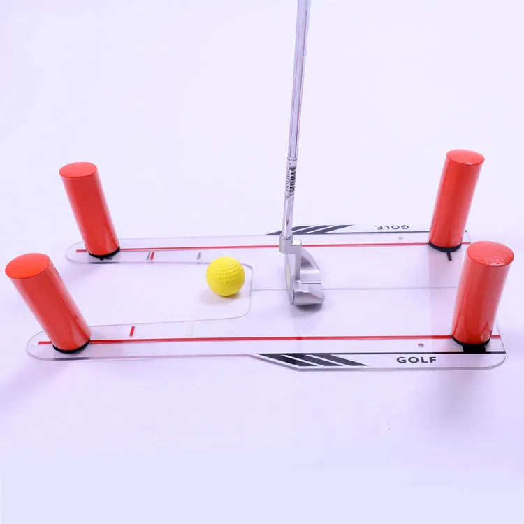 Red plastic putting practice mirror for golf alignment training on grass