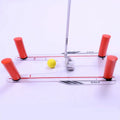 Red plastic putting practice mirror for golf alignment training on grass