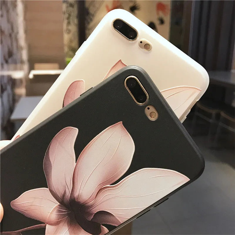 Black and white iPhone TPU cases with a raised embossed floral pattern on the back.