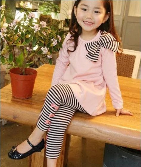 Girls' pink cotton two-piece clothing set shown in sizes 110cm, 120cm, 130cm, and 140cm