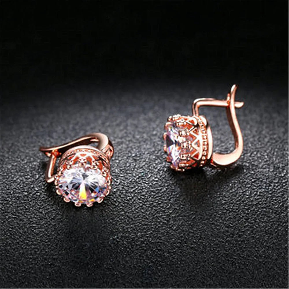 Korean retro crown-shaped clip-on earrings in rose gold and white gold colour finishes on a white background.