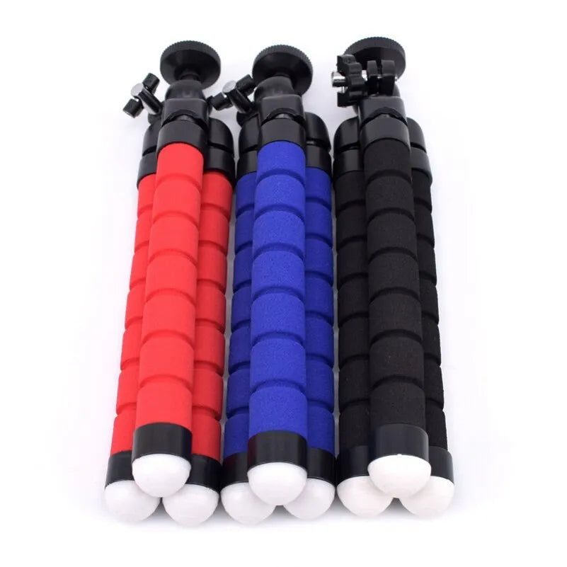 Black flexible octopus tripod wrapped around a pole holding a smartphone