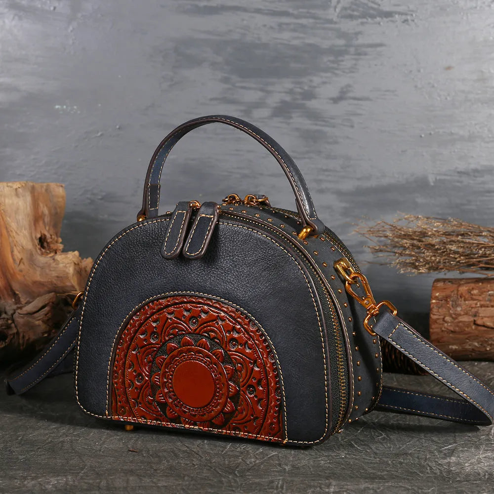 Vintage leather handbag showing internal organisation pockets including mobile phone compartment and ID bag