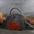 Vintage leather handbag showing internal organisation pockets including mobile phone compartment and ID bag