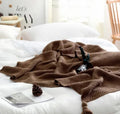 Nordic fringe knit ball acrylic blanket measuring 130×170cm in beige colour