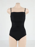 Sling top one-piece swimsuit with belly pleats in blue, shown on a model.
