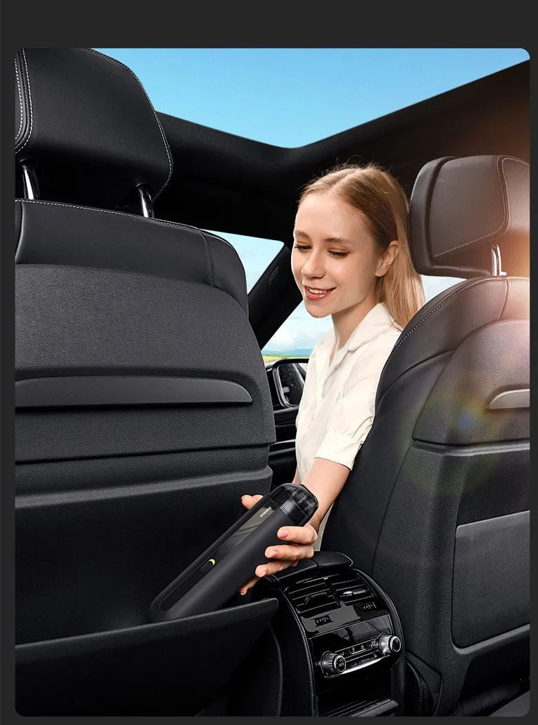 Baseus wireless handheld car vacuum cleaner in black, showing mini size and nozzle attachments.