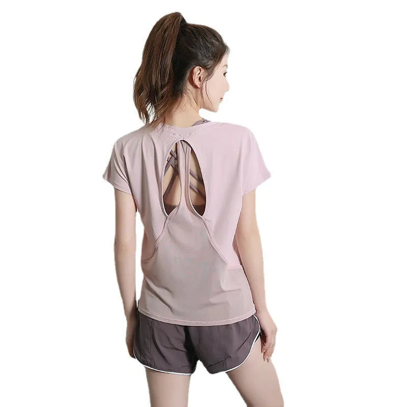 Women's short sleeve polyester sports T-shirt in black, shown flat.