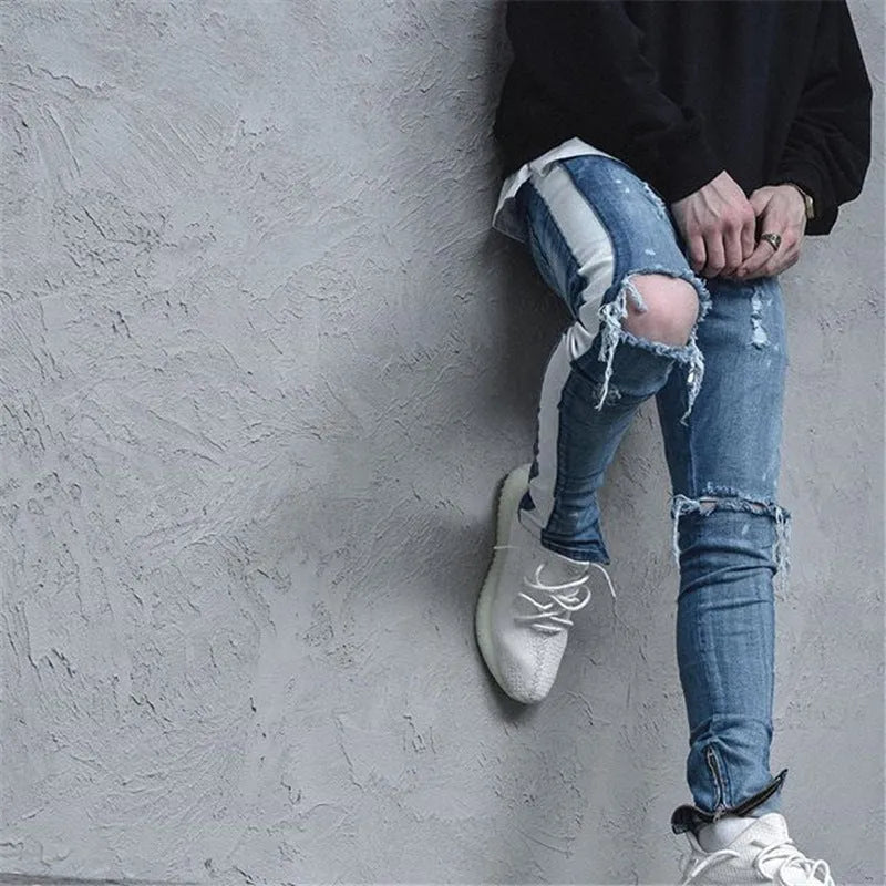 Men's ripped cotton denim jeans in black with distressed detailing, front view