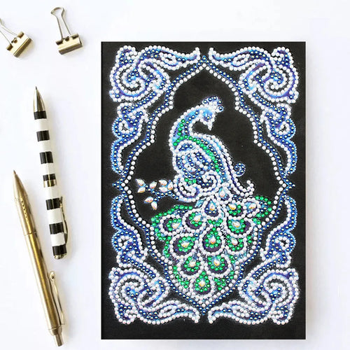 Black A5 diamond painting notebook with peacock design showing shaped and bright drills