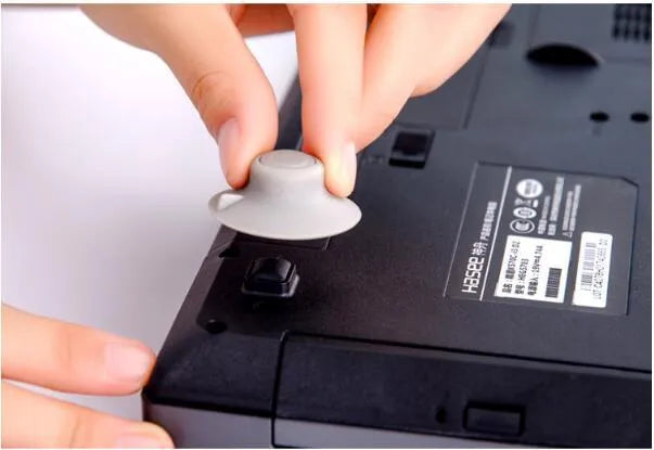 Grey plastic laptop cooling pad set showing large and small sizes on flat surface