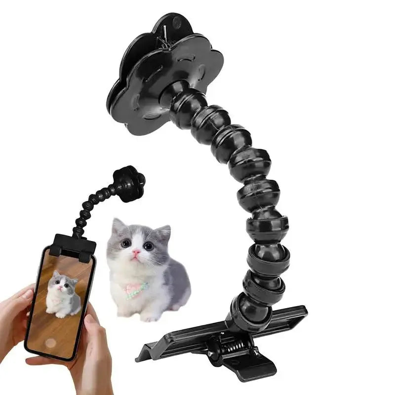 Black plastic pet photography clip holding a phone, with a rotating arm to grip dog or cat treats for photos.