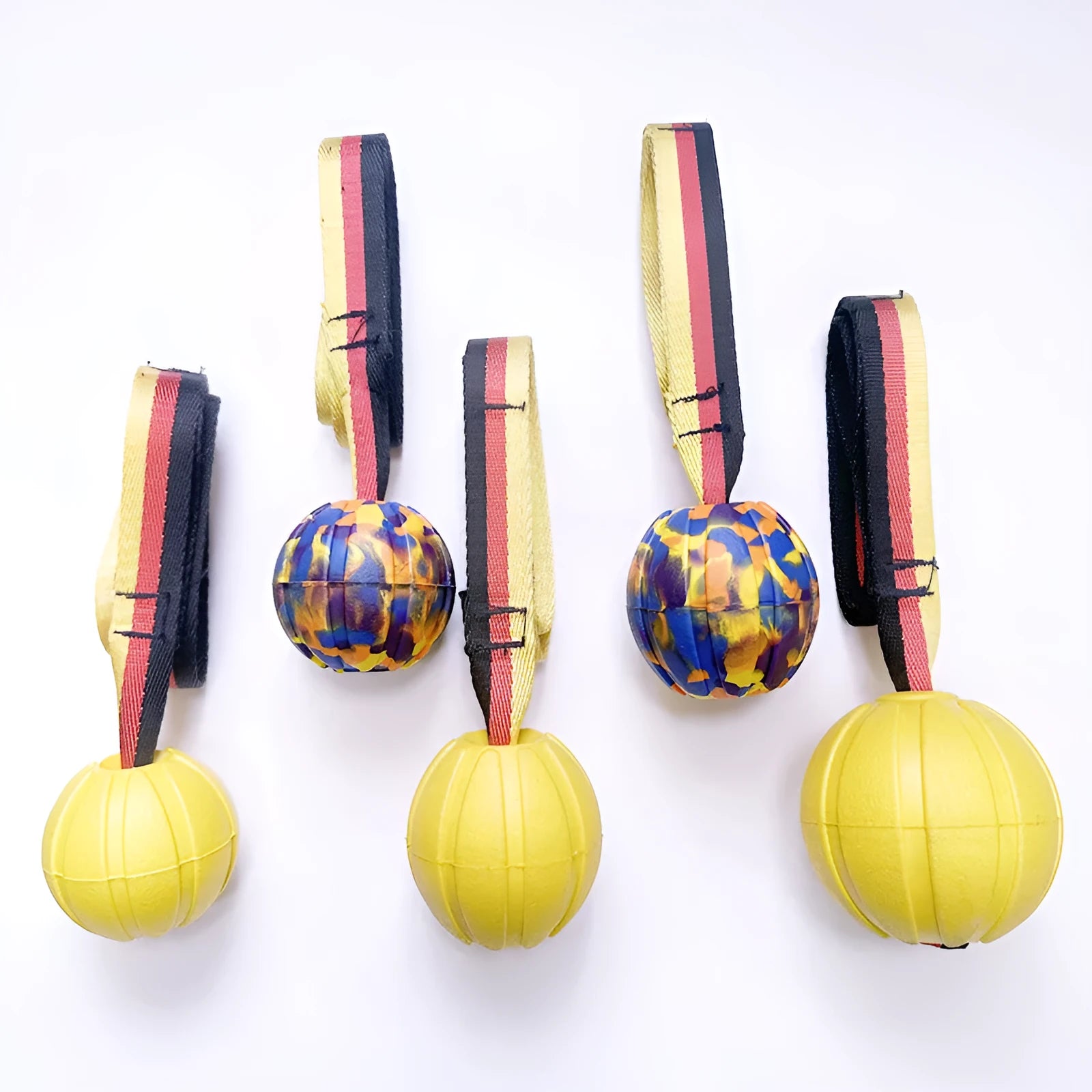 Floating EVA dog training ball with attached string in camouflage or yellow colour options