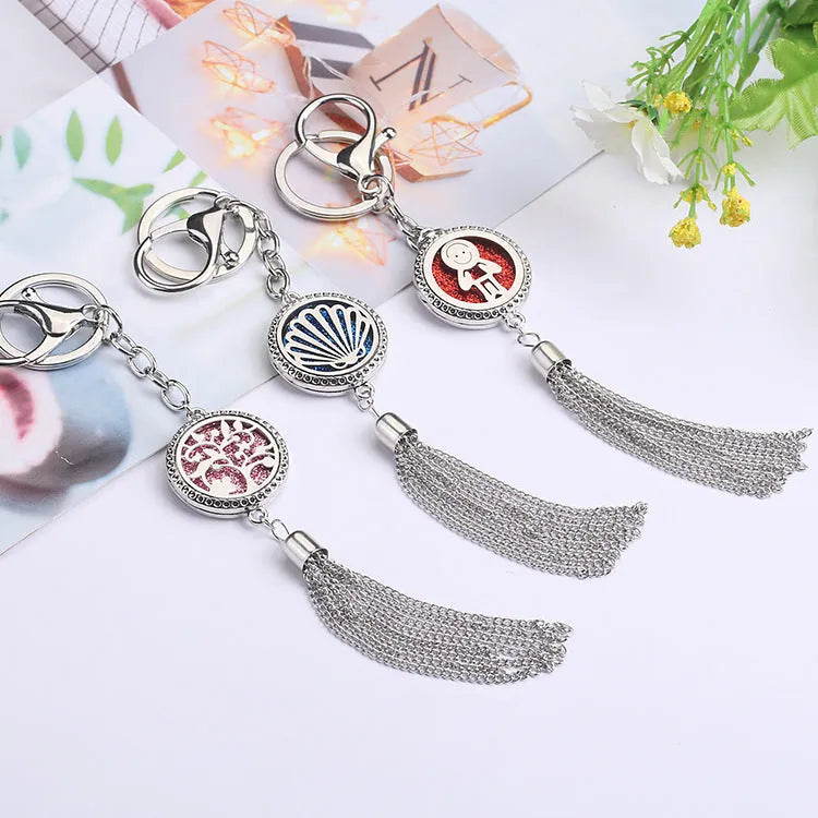 Silver alloy tassel car pendant on a chain with coloured scent cotton pads for essential oils.