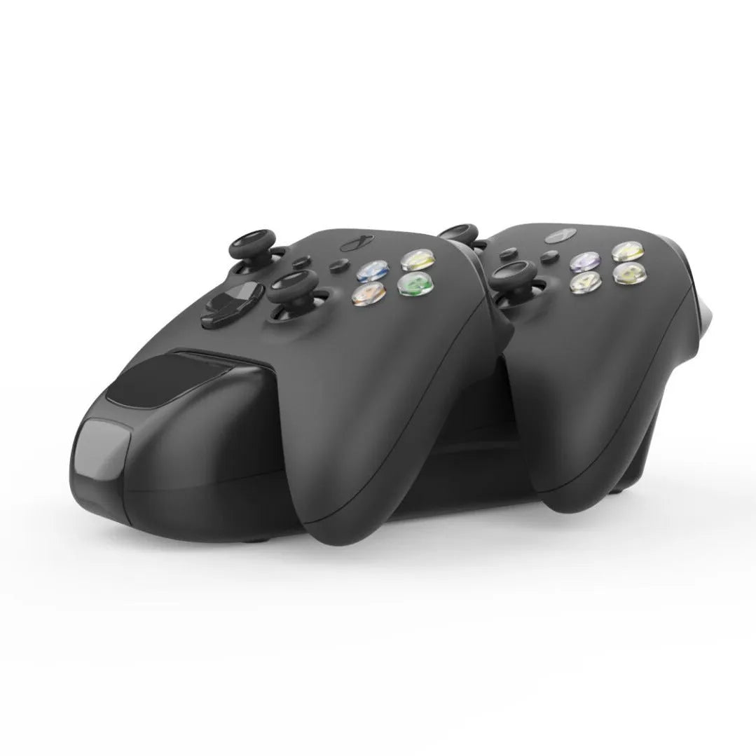 Black wireless charging station for two Xbox Series X|S controllers with LED lights, shown with battery packs.